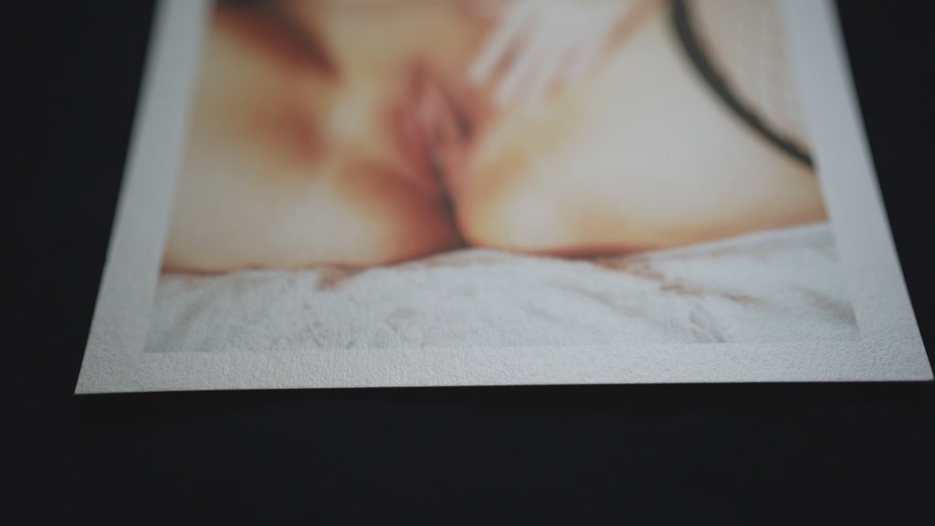 Woman with Black Fishnet on White Bed in Erotic Pose